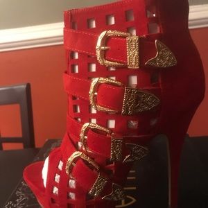 Red high heel shoe w/buckles